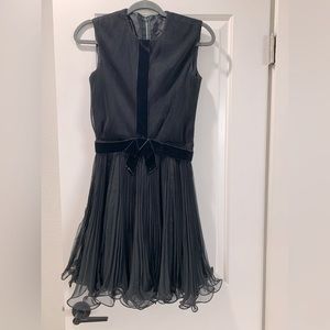 Vintage dress from- adorable flared bottom with velvet bow.